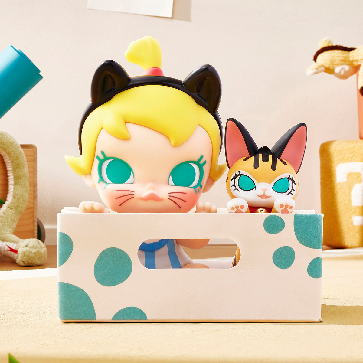 Baby Molly & Baby Tabby Series Figures in a playful scene, featuring a toddler figure with cat-ear headband and matching cat figurine in a polka dot box.