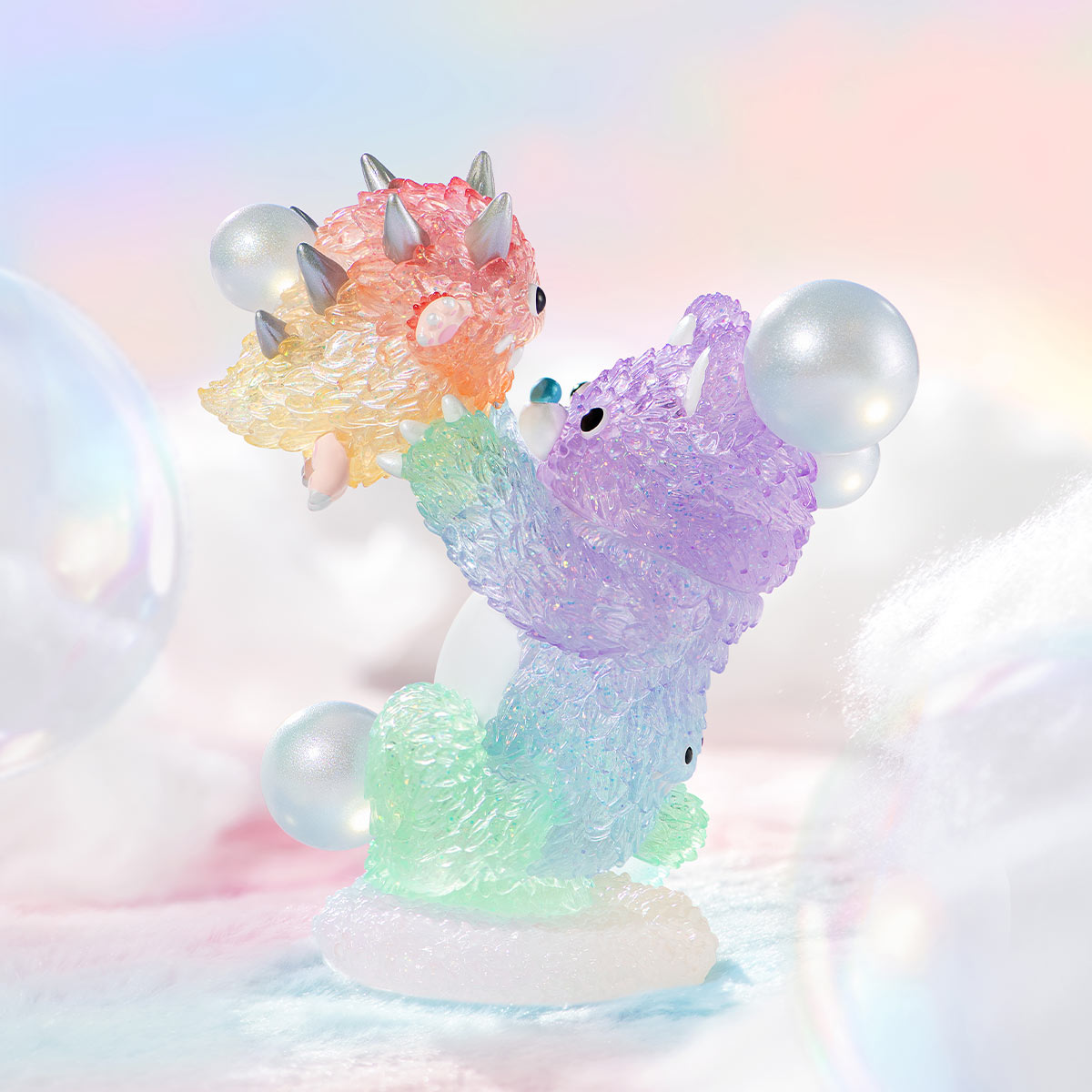 INSTINCTOY Muckey Celebration gift Series Figures featuring two whimsical, semi-translucent creatures with bubble orbs, posed on a fluffy base in a dreamy setting.
