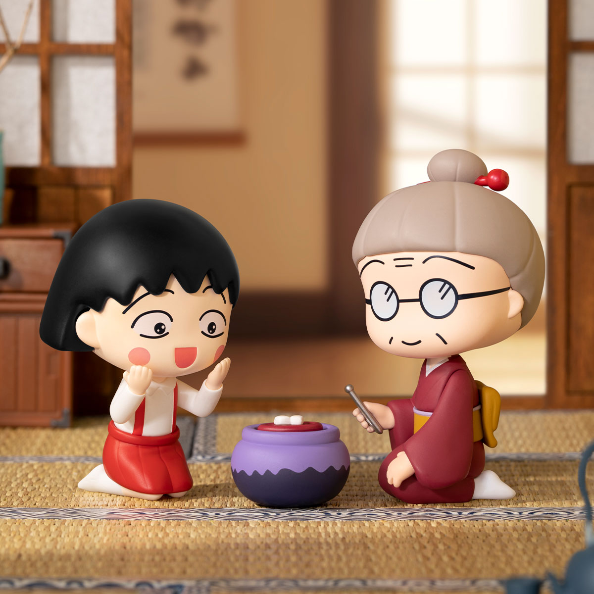 Chibi Maruko Chan's The Time With You Series Figures featuring a girl and elderly lady toasting mochi in a traditional Japanese room.