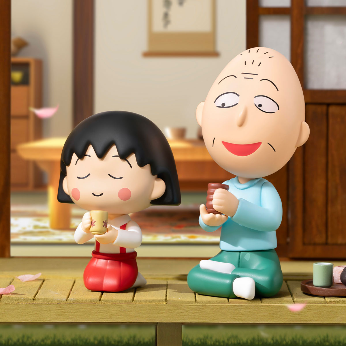 Chibi Maruko Chan's The Time With You Series Figures: Two chibi figures enjoying tea on a Japanese porch, capturing serene tradition with delightful detail.