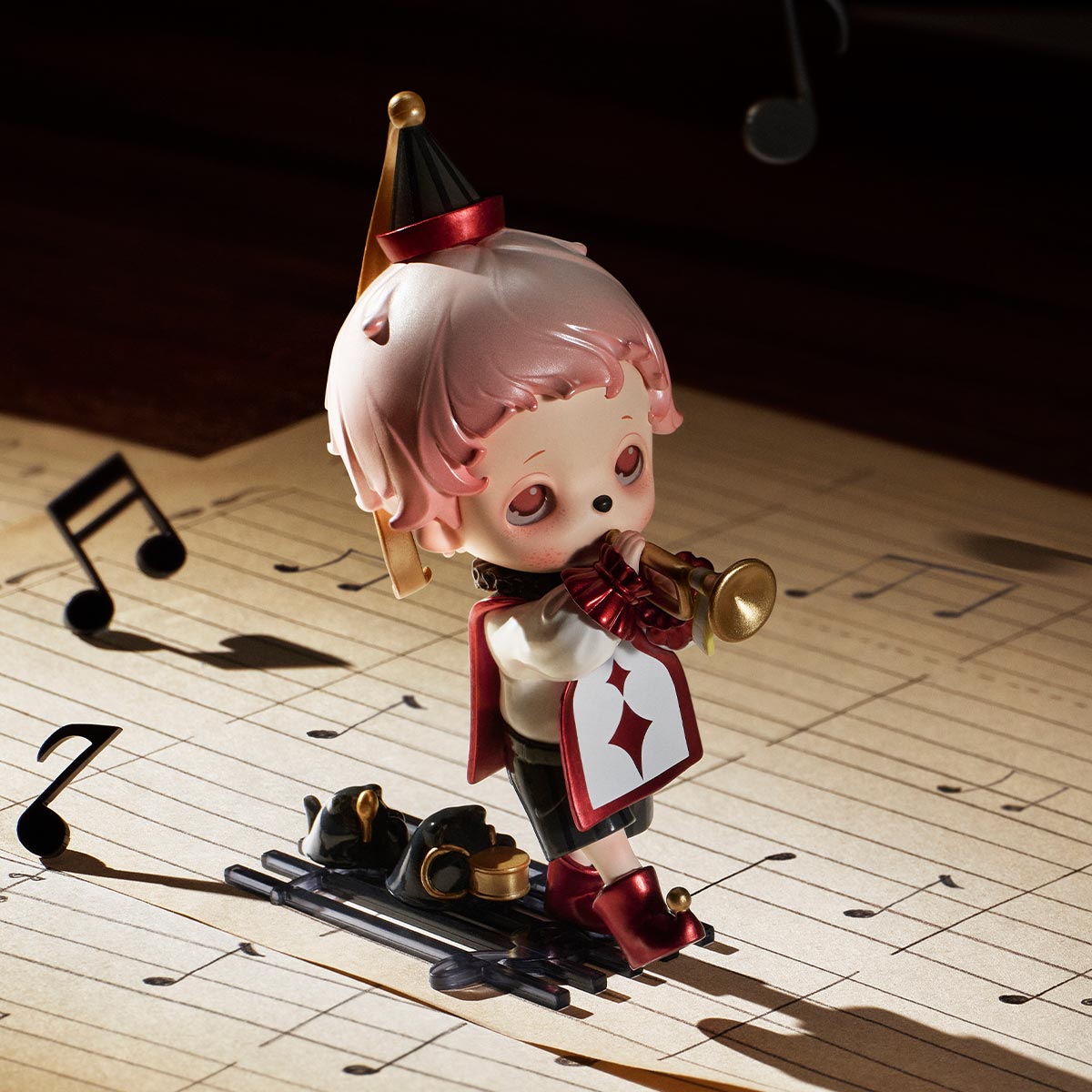 Inosoul In the Still Room Series Figure: Chibi-style character with pink hair, jester tunic, blowing a trumpet on musical sheet, part of a collectible set.