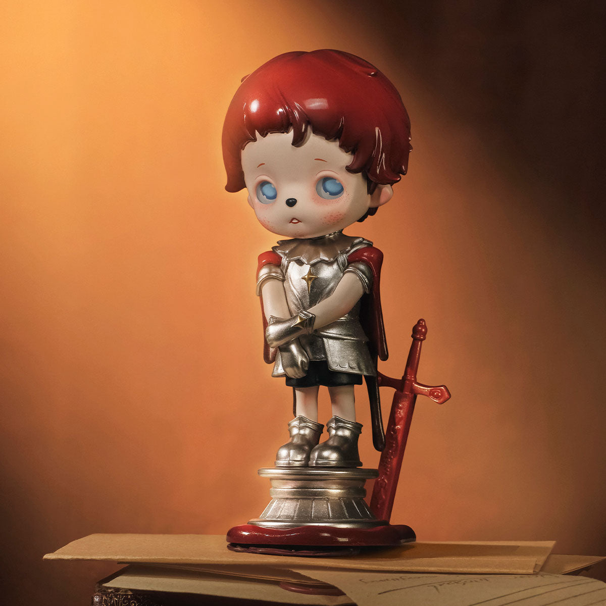 inosoul In the Still Room Series: Child-like knight figurine with red hair, silver armor, and cape, standing on pedestal. Part of a collectible blind box series.