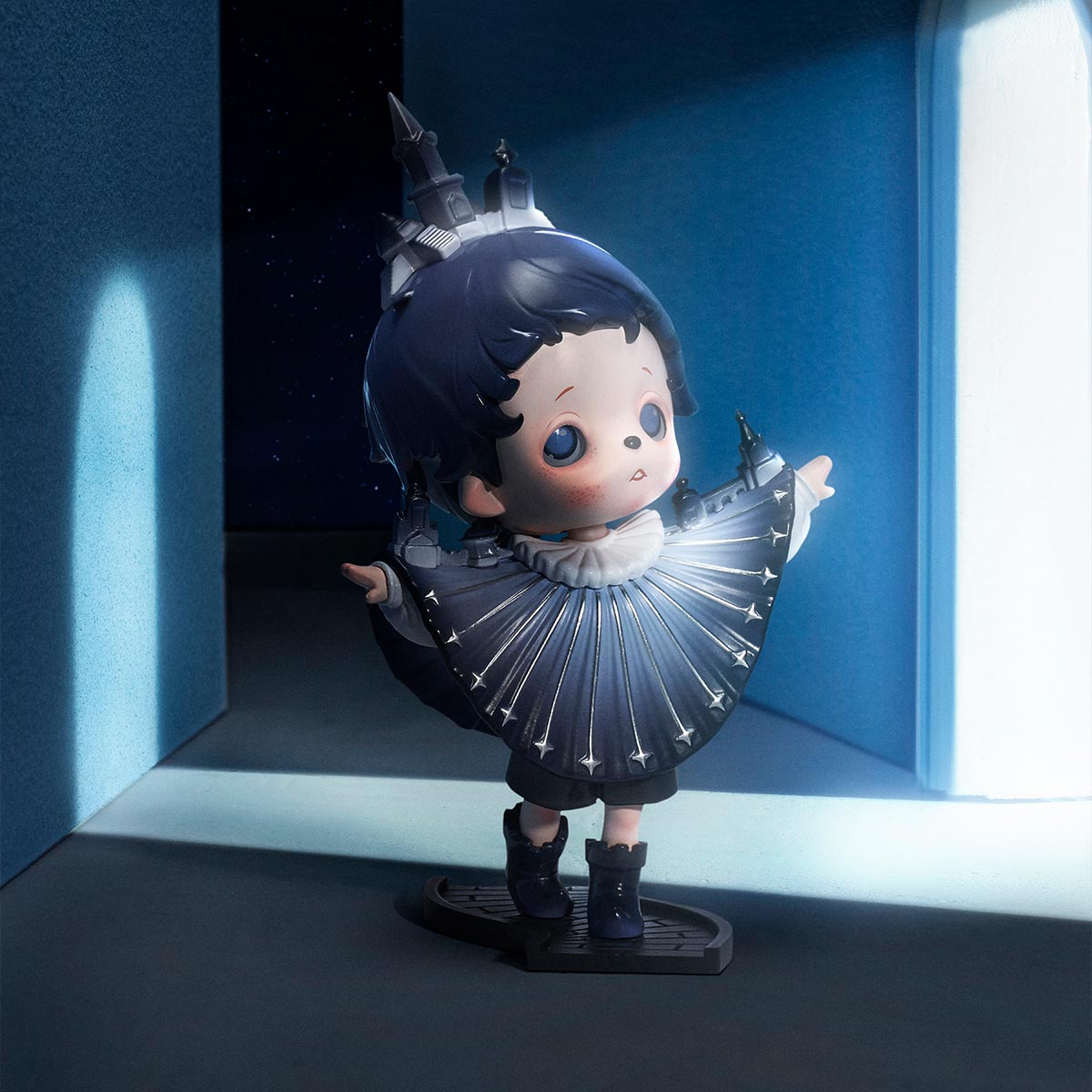 inosoul In the Still Room Series Figure: a childlike figurine in starry tunic, castle-like headpiece, posed on display base.