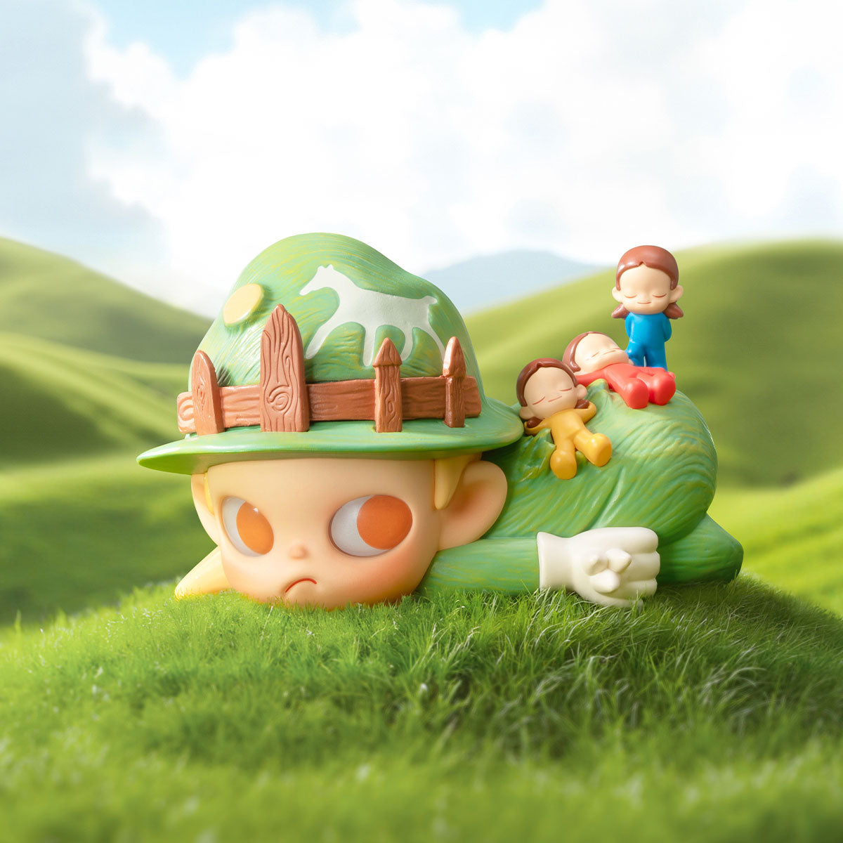 Zsiga Take It Slow Series Figure features a child-like head with a green hat, wooden fence, white horse, and tiny cartoon children on a grassy hill.