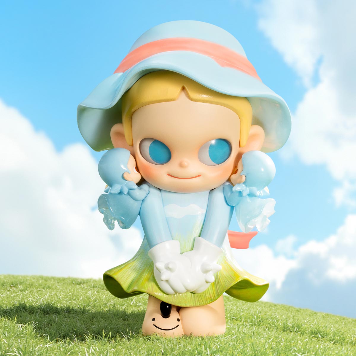 Zsiga Take It Slow Series Figure: A vinyl toy of a girl in a sun hat with a playful character peeking out at her feet.