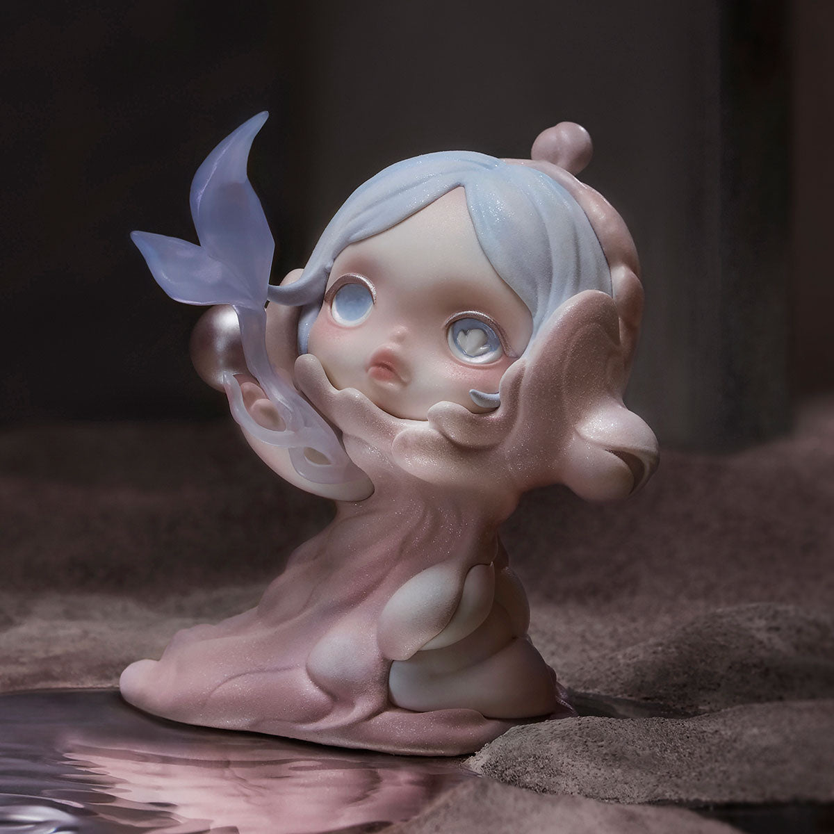 SKULLPANDA The Paradox Series Figure: A dreamy, child-like sculpture merging into a mermaid with a pink base and lavender-blue tail, available for preorder.