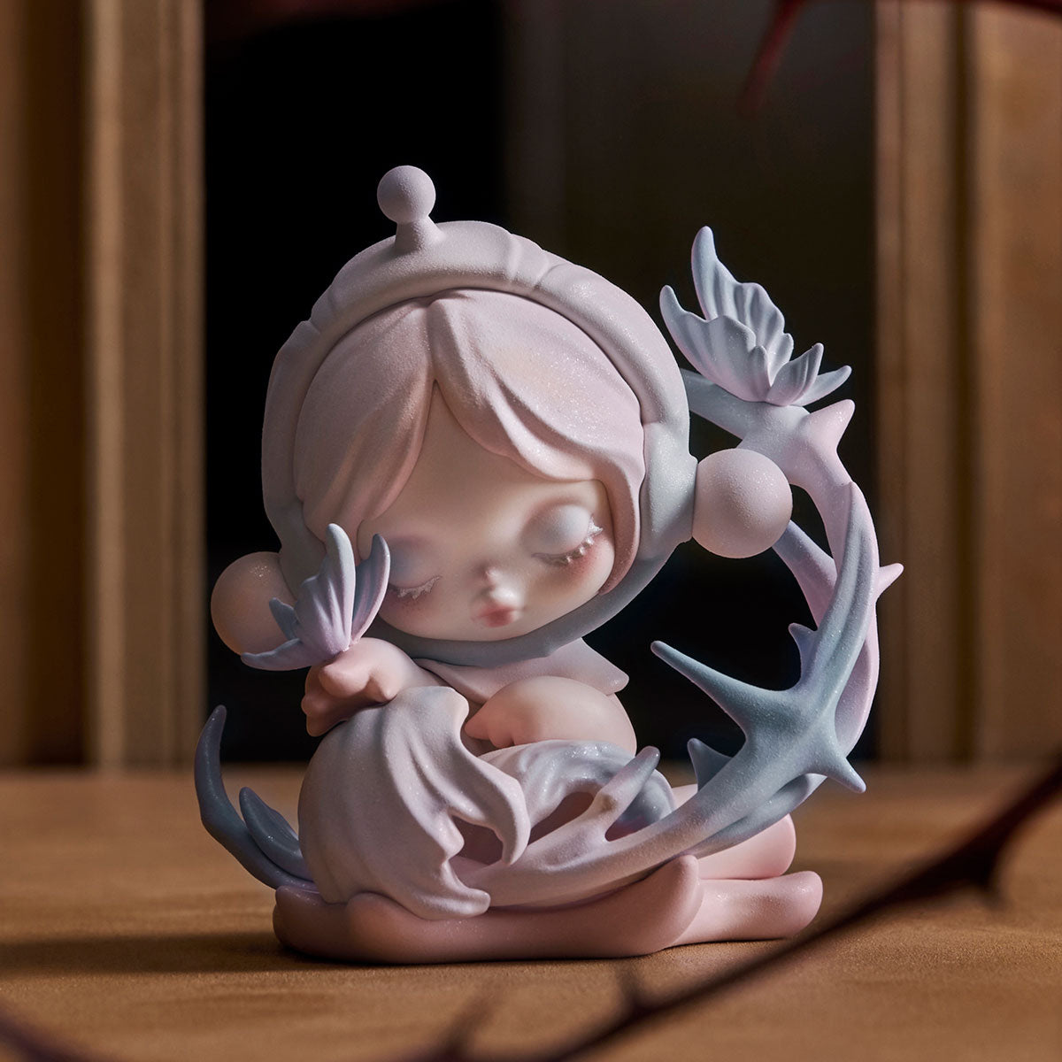 SKULLPANDA The Paradox Series Figure: A chibi-style collectible with closed eyes, holding a petal-shaped object, surrounded by tendril-like forms, crafted in smooth, matte resin.