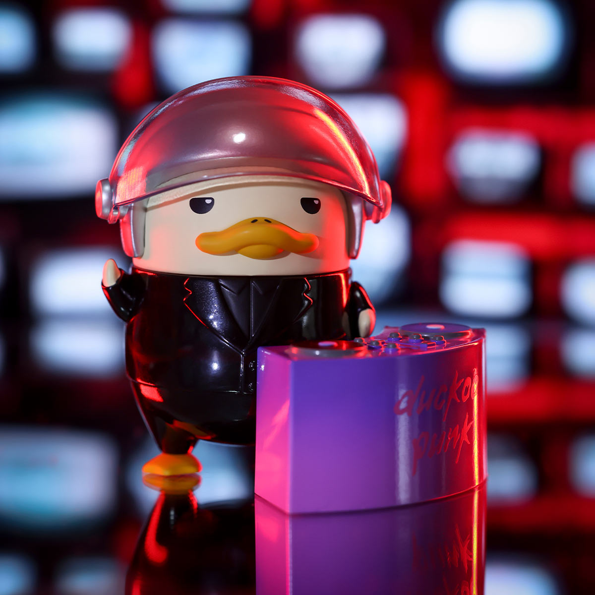 DUCKOO Music Festival Series figurine: a duck in a shiny black suit with a DJ visor, standing by a purple DJ booth. Preorder for October 2025.