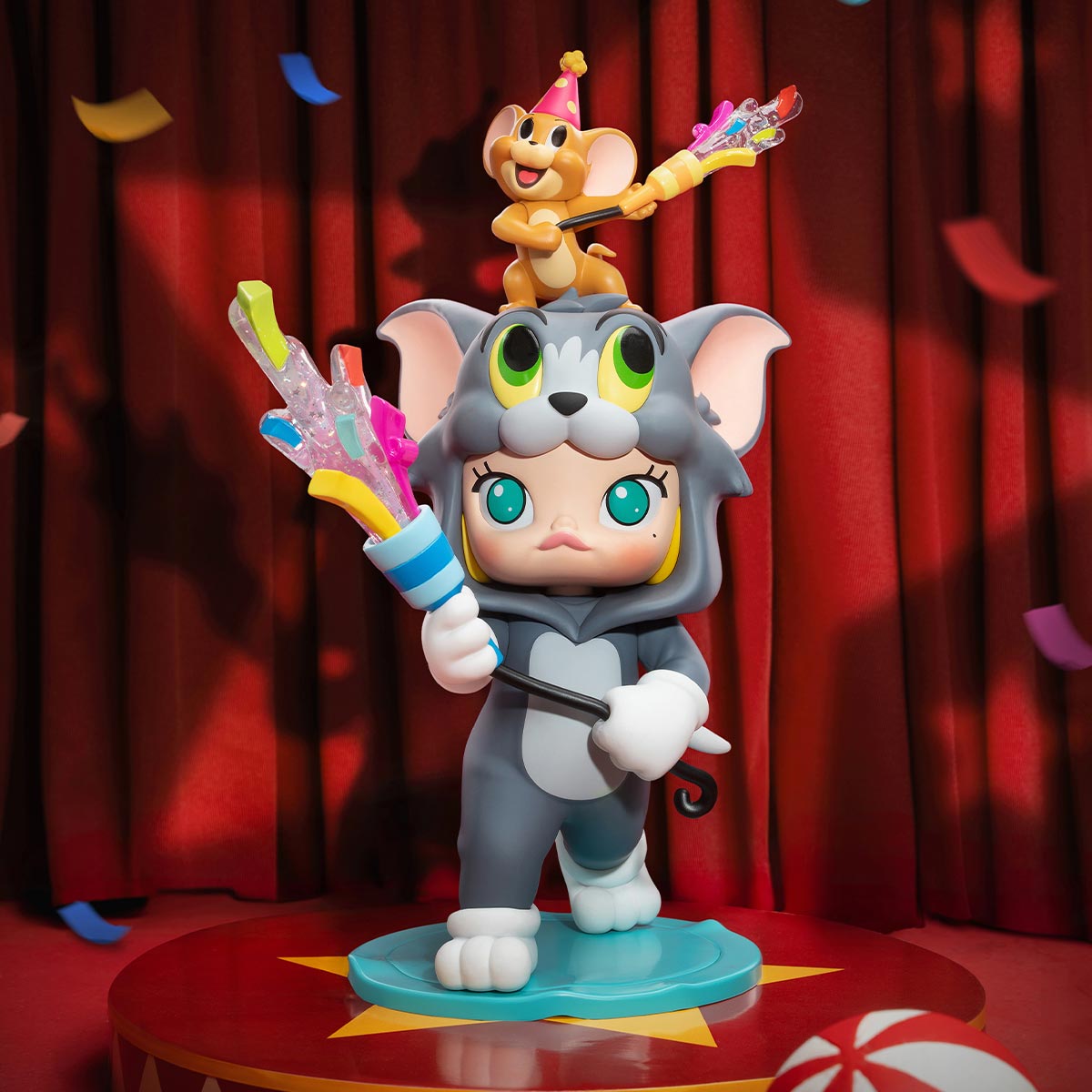 MOLLY × TOM & JERRY Figurine: Child-like figure in cat onesie with confetti-blaster, tiny mouse on head, creating a circus vibe. Preorder available.