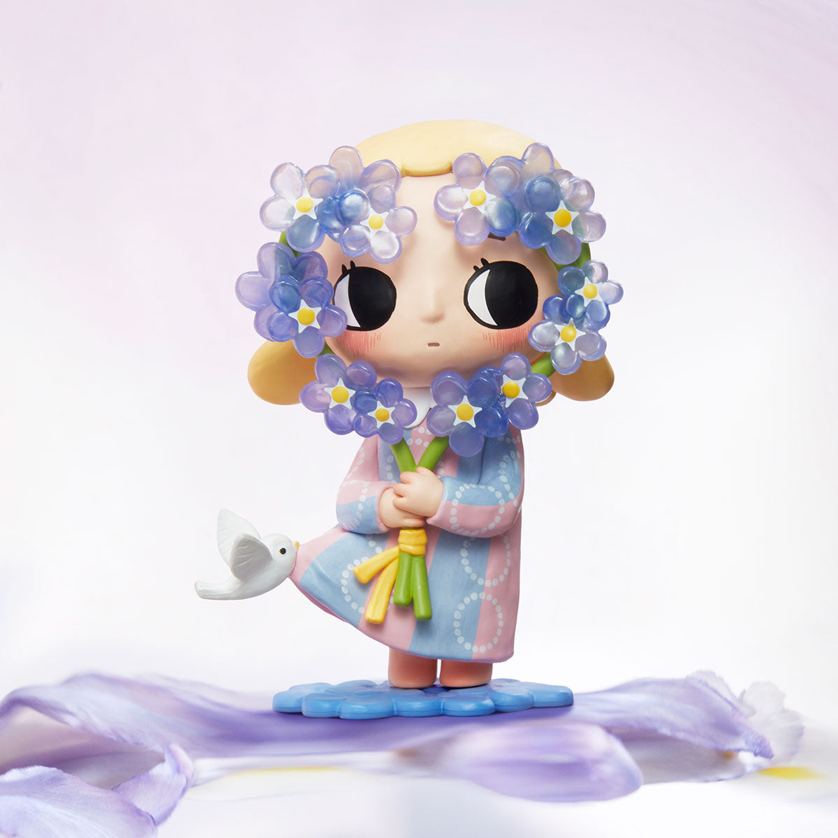 Nyota I Am the Seasons Series Figure, depicting a whimsical girl with flowers and bird, on a petal base; preorder for November 2025.