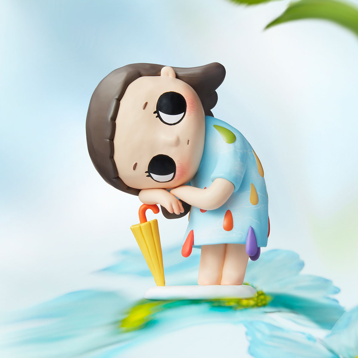 Nyota I Am the Seasons Series figurine pre-order, featuring a chibi girl in blue dress with umbrella, set on a white base with blue petal.