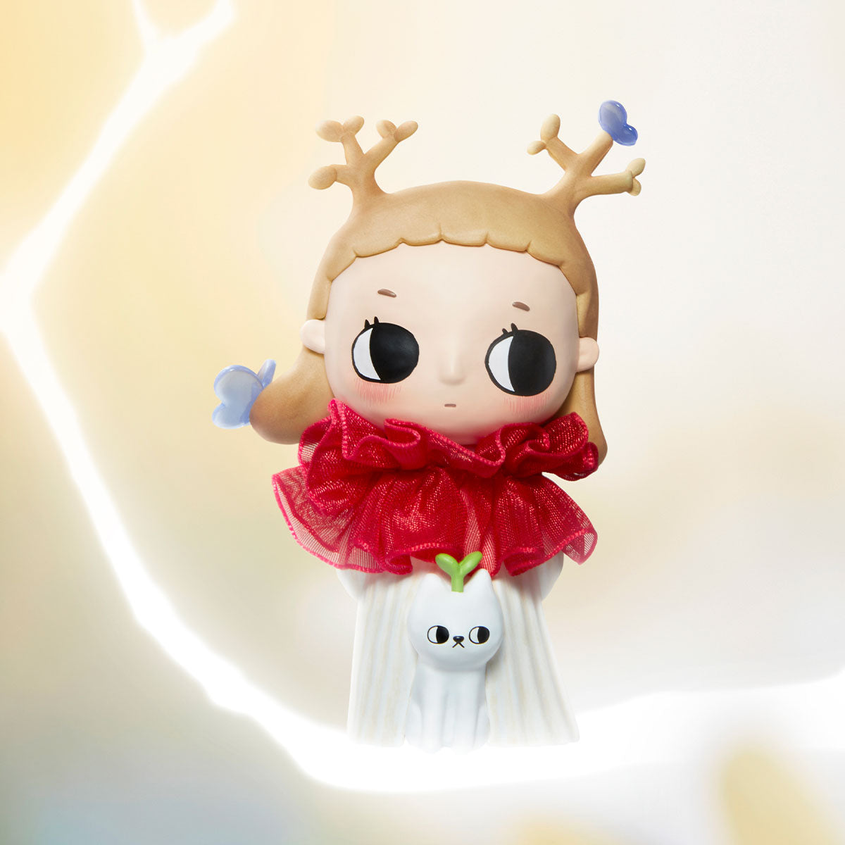 Nyota I Am the Seasons Series figurine: a round-faced character with antlers, red collar, white skirt, tiny cat figure, available for preorder, ships November 2025.