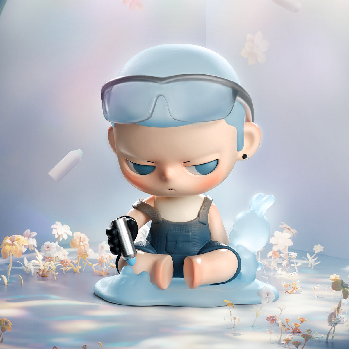 KUBO City of Sunset Series Figure: A chibi-style character with blue hair, goggles, holding a dripping spray-can, surrounded by floral elements and a bunny-shaped liquid.