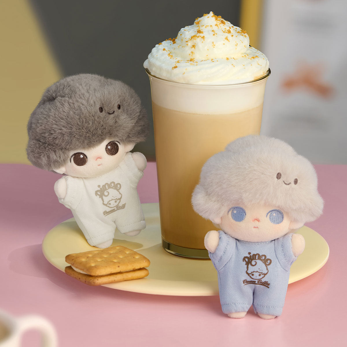 DIMOO Crush on Coffee Series plush keychains displayed with a latte and biscuits, featuring two plush dolls with distinctive afro-style hair, against a pastel background.