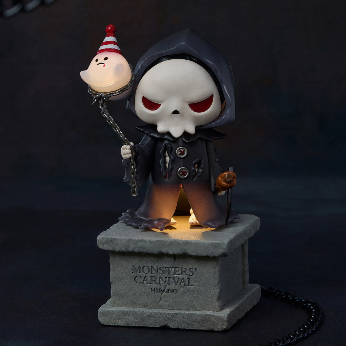 Hirono Monsters' Carnival Series Figure: Grim Reaper with ghost balloon on stone pedestal. Preorder now, ships end of Nov 2025.