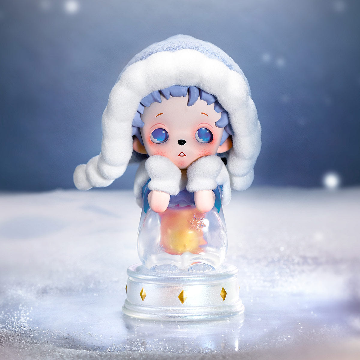 inosoul The Forgotten Land Series Figures - Preorder: A figurine in winter gear, leaning on a globe with a glowing star inside, set for January 2026 release.