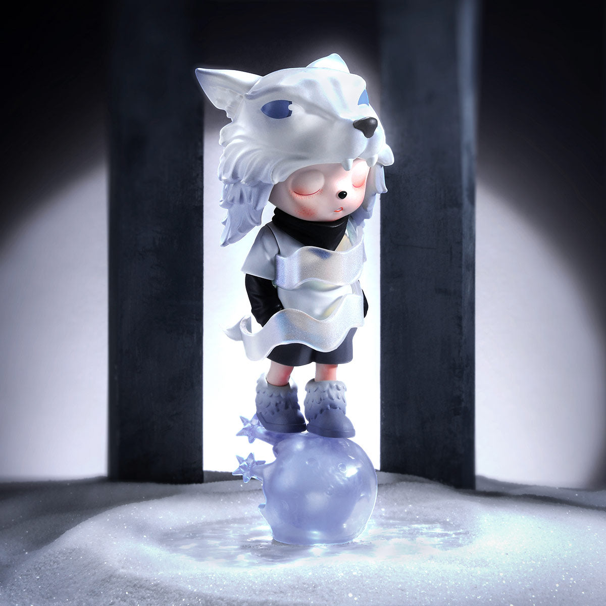 Inosoul The Forgotten Land Series figure in a wolf-head hood, standing on an ice-blue orb, spotlighted in a snowy scene. Preorder for January 2026.