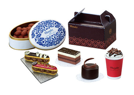 Chocolaterie Re-ment Blind Box Series featuring assorted boxed chocolates, pastries, and a hot drink, all branded “Remedy” with detailed, collectible designs.