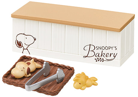 SNOOPY'S BAKERY Re-ment Blind Box Series featuring toy designs, including a dog and basket, sold in a complete set of eight designs.