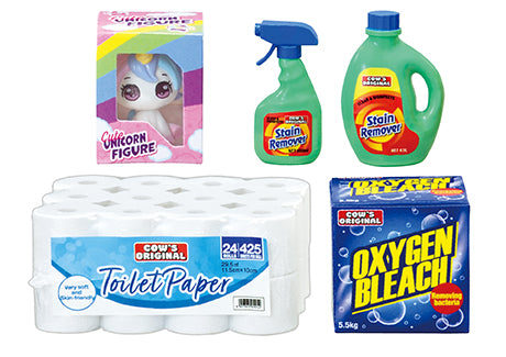 Five packaged items from the COW'S MART Re-ment Blind Box Series, including a unicorn figure, stain removers, toilet paper pack, and oxygen bleach powder.