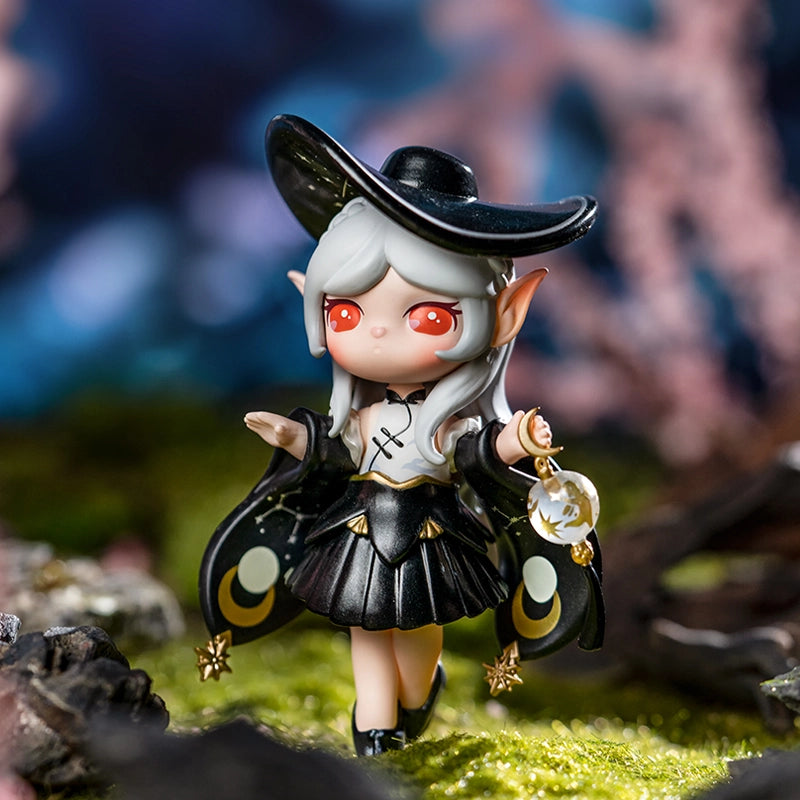 Chibi elf-witch figurine from the Paradise Guardians Blind Box Series, featuring a crescent-moon outfit and lantern, posed on a woodland surface.