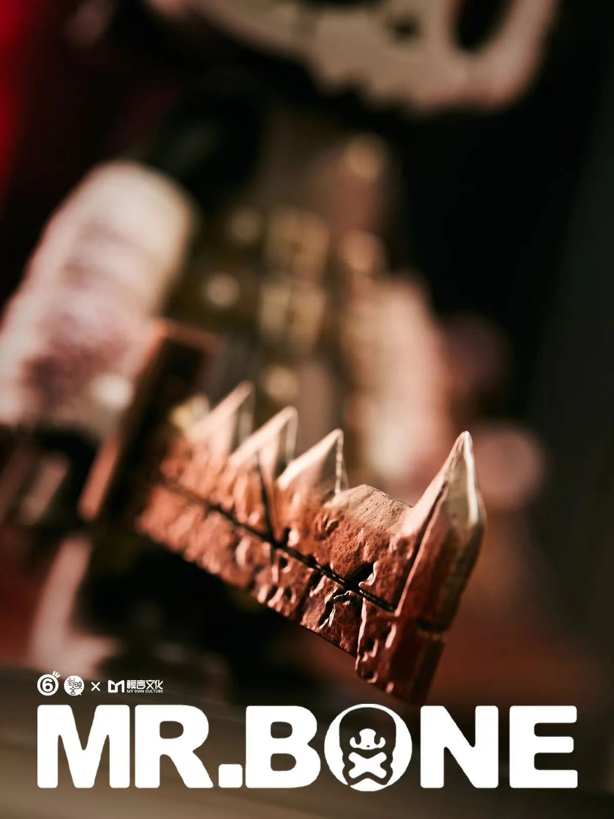 Close-up of a metal blade with triangular spikes, featuring MR. BONE branding. Mr. Bone - Pyramid Head 200% figure, limited edition preorder from Strangecat Toys.