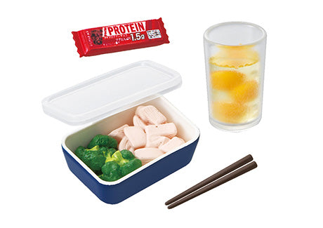 Puchi Sample Light Today's breakfast Re-ment Blind Box Series featuring a plastic food container, broccoli, orange juice, and chopsticks.