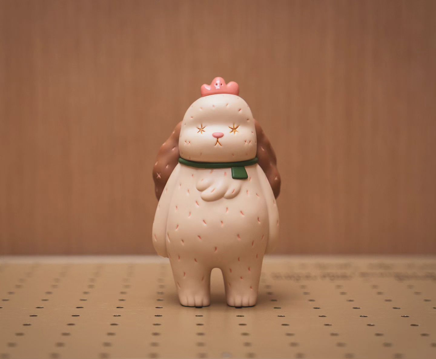 A vinyl figurine of a toy animal with a crown by EGGZY, 14.6cm.