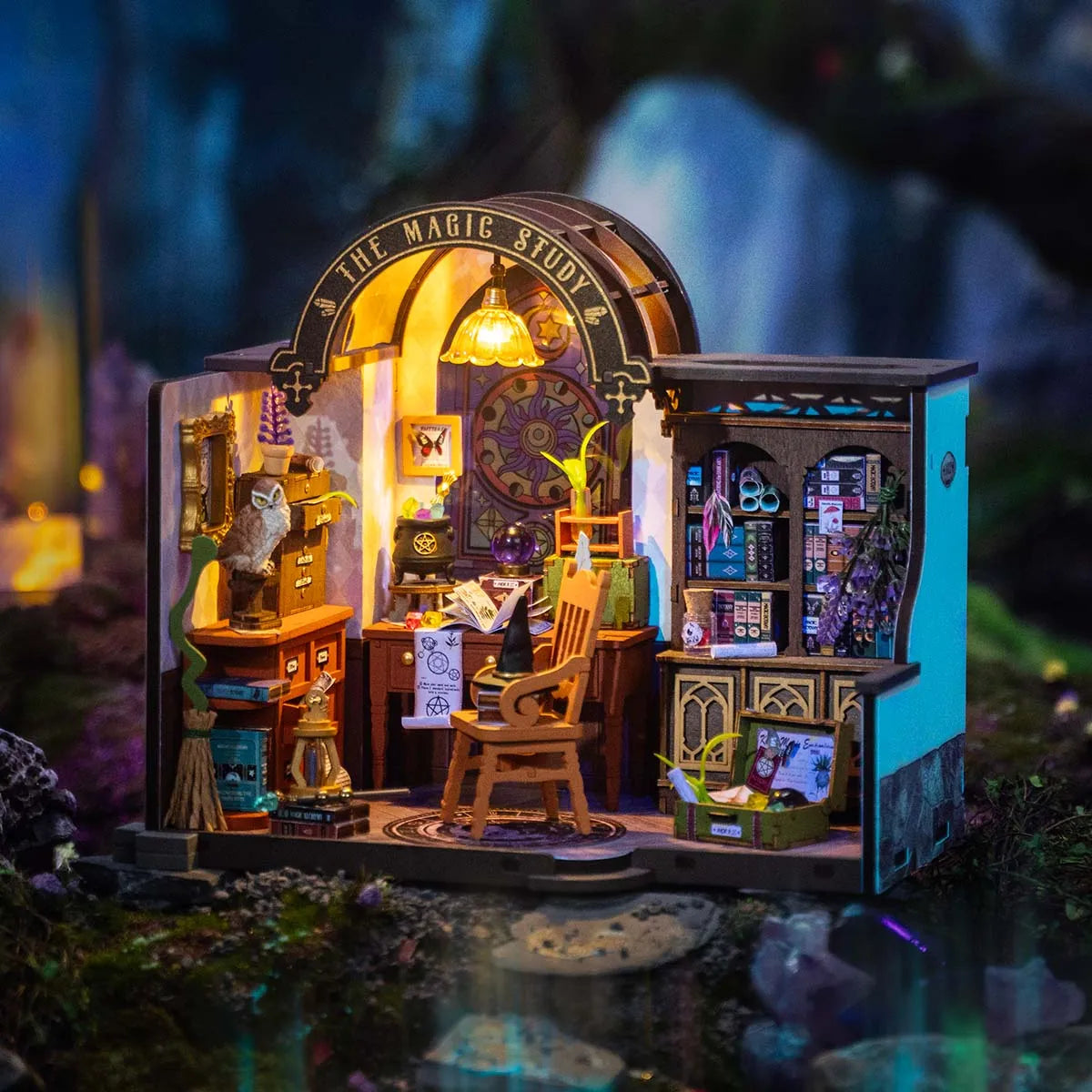 DIY Miniature House - The Magic Study DG166 featuring a spellbound setup with a miniature bookcase, chair, table, and magical elements for crafting enchanting scenes.