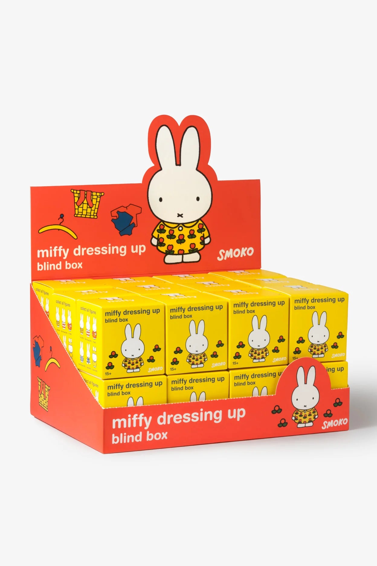 Countertop display of Smoko Miffy Dressing Up Blind Box Figures, featuring a dozen yellow packets with Miffy on the front, offering surprise collectible figures.
