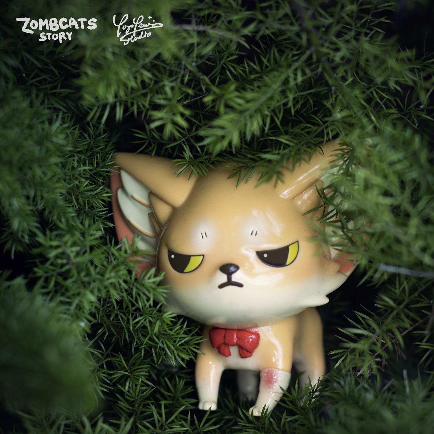 A limited edition Zombcat toy, Doomsday Biology Atlas - Doomsday Fox Kenneth by Morimei X Yoyo Yeung Studio, perched in a tree. Soft vinyl, 7cm, exclusive to North America.