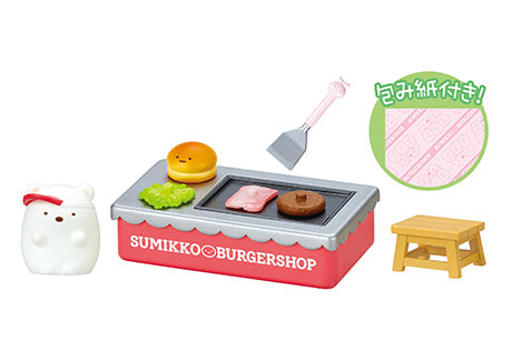 Sumikogurashi Burger Shop Re-ment Blind Box Series featuring a toy burger shop setup with a table, bench, spatula, and bear figurine. Includes eight collectible designs.