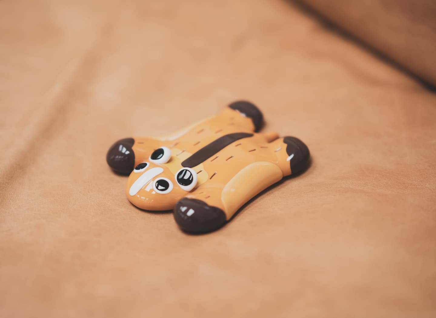 Vinyl Squirrel Carpet by Vin, a 5-inch animal-shaped art toy, shown on a brown surface. Part of Strangecat Toys' unique collection.