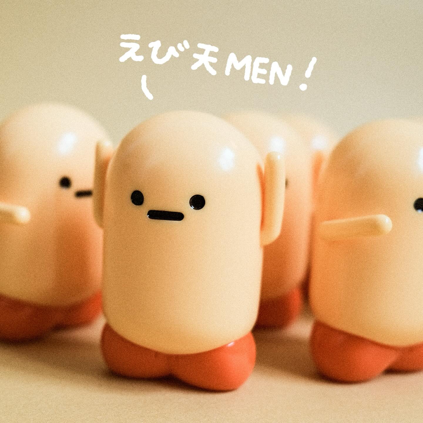 Shrimp Man by Crazy Eyes, a 7.5cm soft vinyl figurine, part of Strangecat Toys' unique toy collection, shown among other small plastic figures.