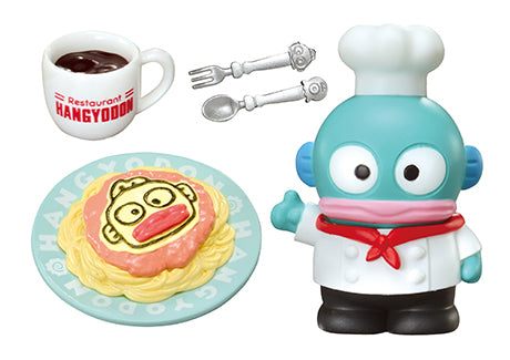 Family Restaurant Hangyodon Re-ment Blind Box: Miniature scene with Hangyodon chef figurine, mug, toy utensils, and spaghetti plate featuring Hangyodon’s face.
