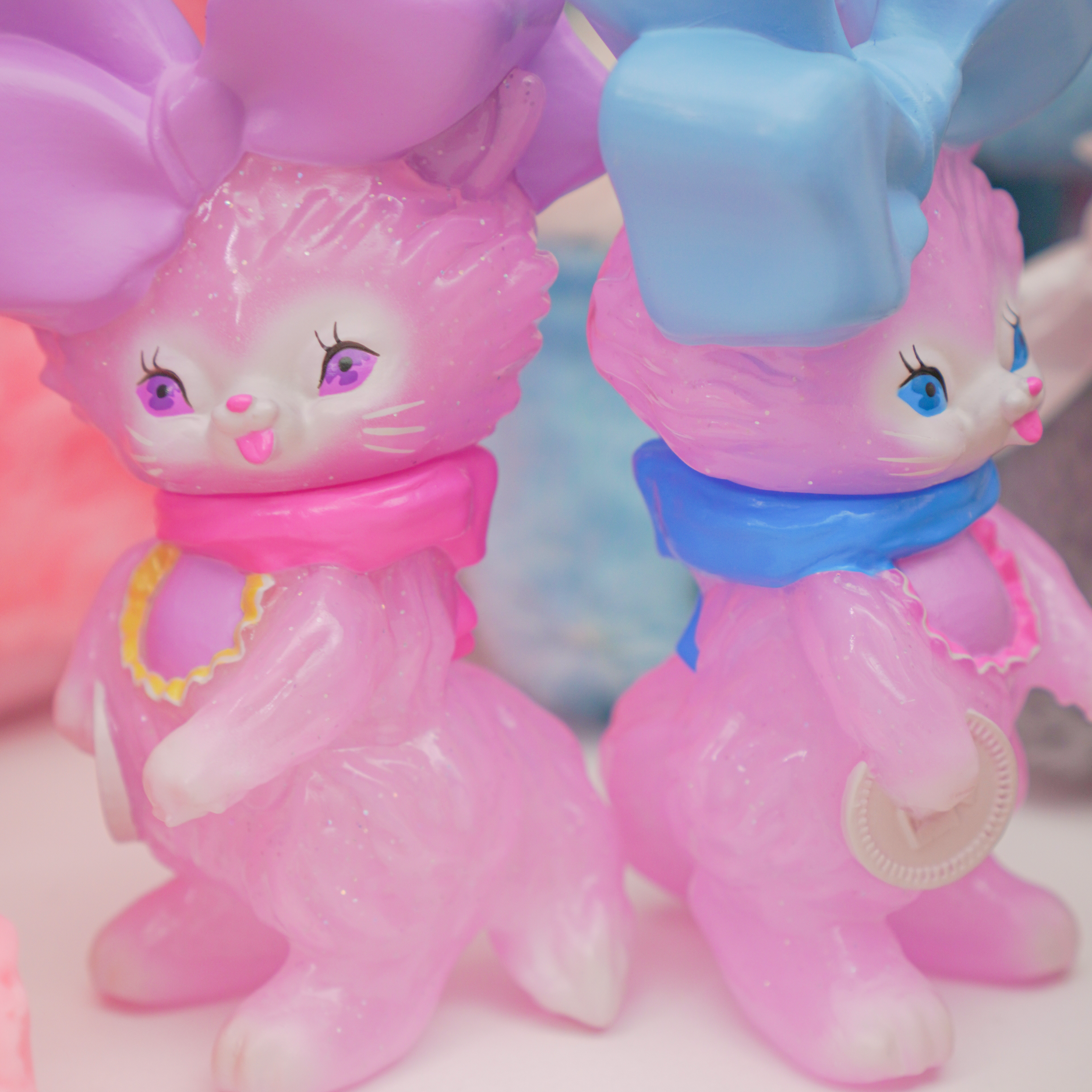 Bab Kat - Sugar Sweet Pea by Ms LUTRA, a 130mm sofubi figurine, featuring a pink cat with bows, reflecting the playful art toy style of Strangecat Toys.