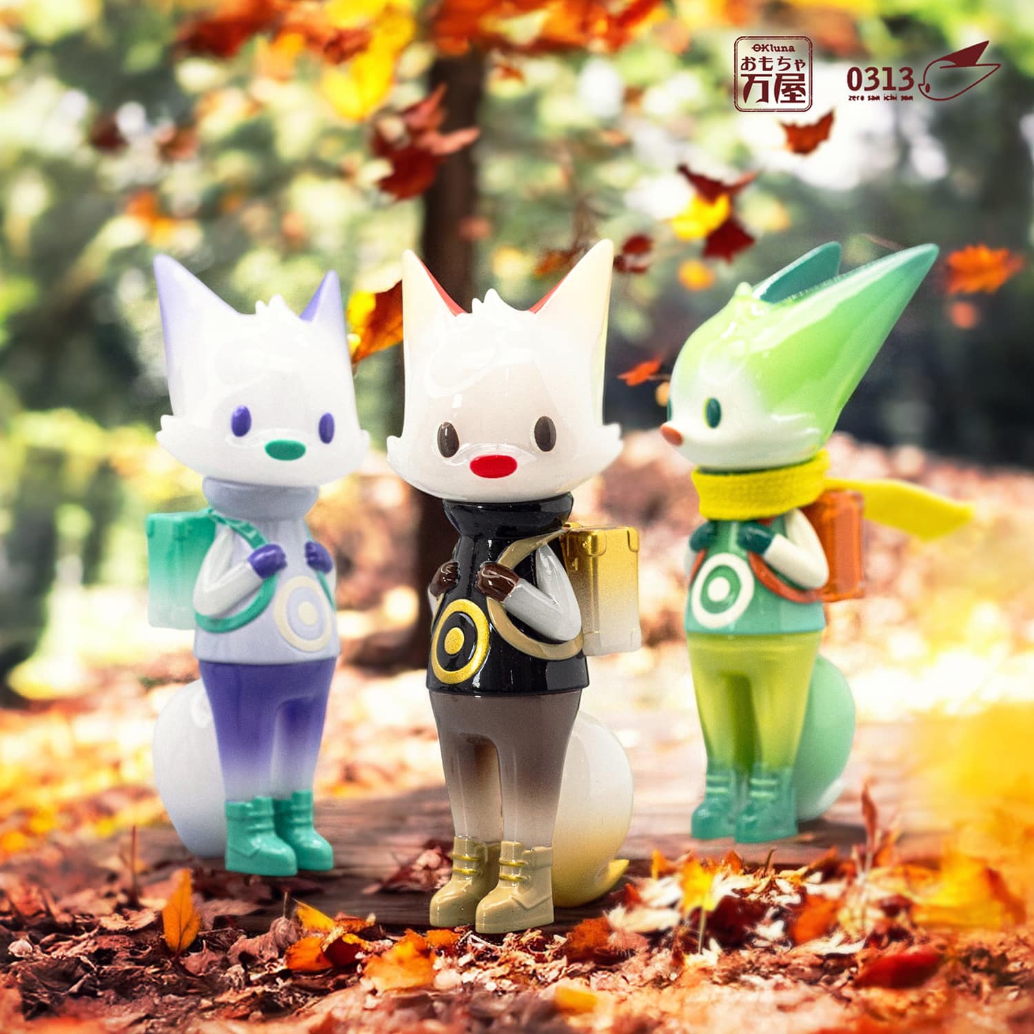 0313 x okluna - Traveler Phase 6 soft vinyl figure, 11cm, depicting a toy animal with a yellow scarf and bag. Limited edition of 80 pieces.