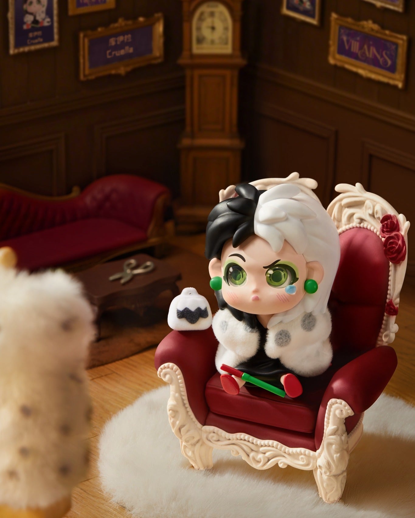 Disney Villains Born Rebellious Series figure of Cruella de Vil in a baroque armchair, with Dalmatian plush and cigarette holder, preorder for Strangecat Toys.