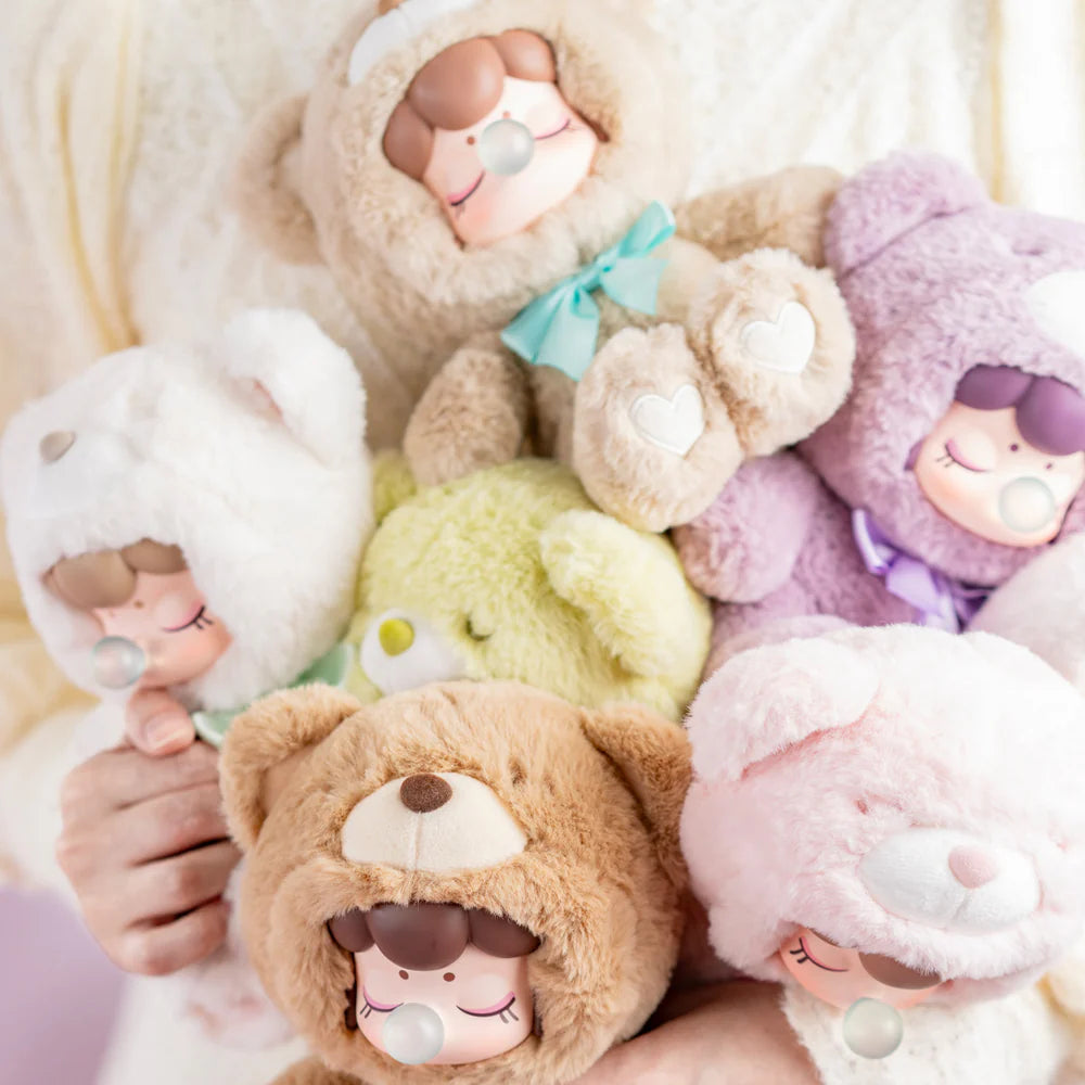 Nanci Colorful Chocolate Cutie Bears Plush Blind Box featuring a person holding multiple stuffed toy bears, showcasing the variety of character designs available.