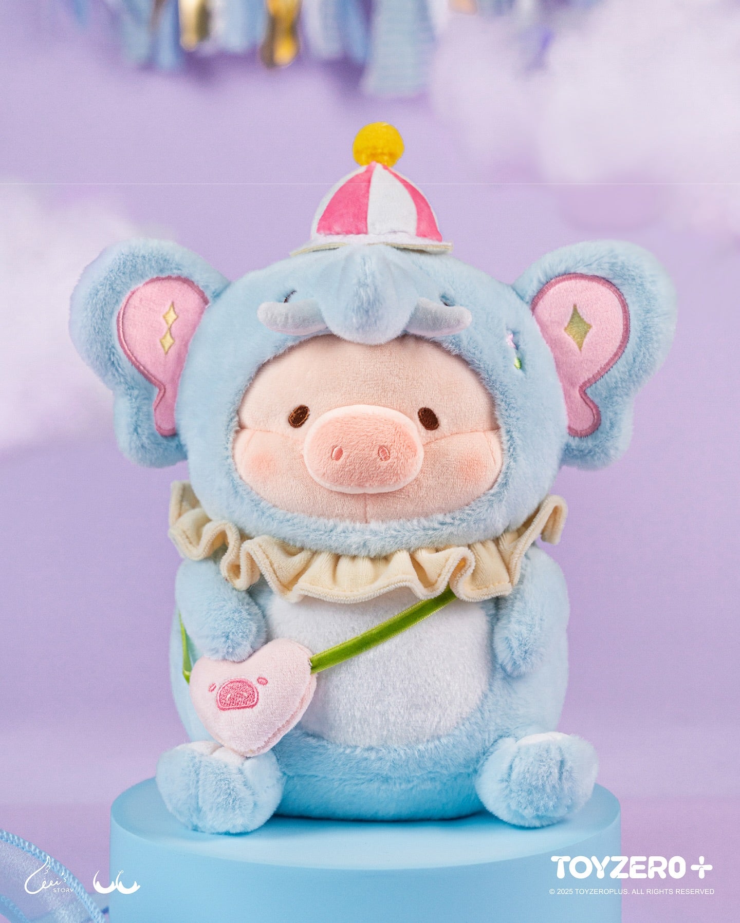 LuLu the Piggy LuLuLand - Tender Elephant Lu Plush, a piglet in elephant costume with a carnival hat and heart pouch, available for preorder.