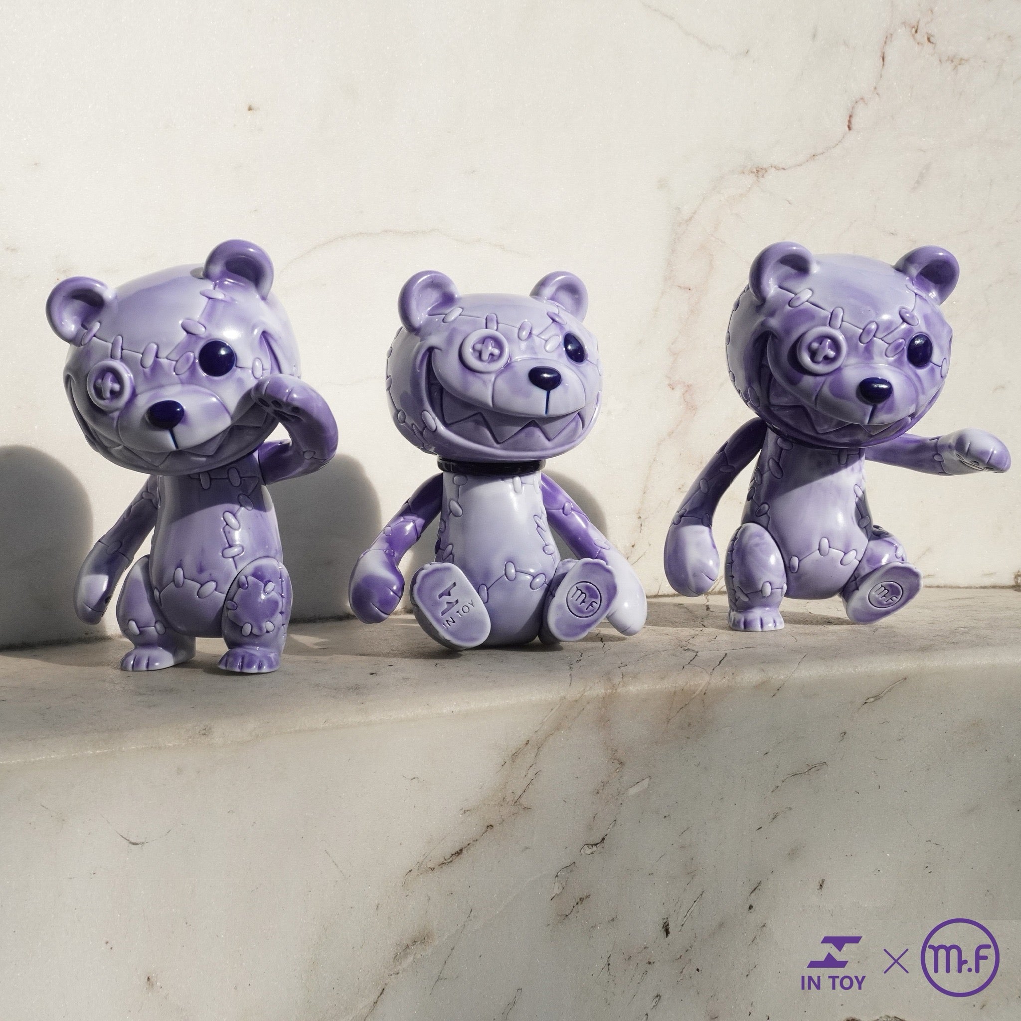 A group of movable purple teddy bears with smiling faces, about 16cm high, made of soft vinyl by Mr.F.
