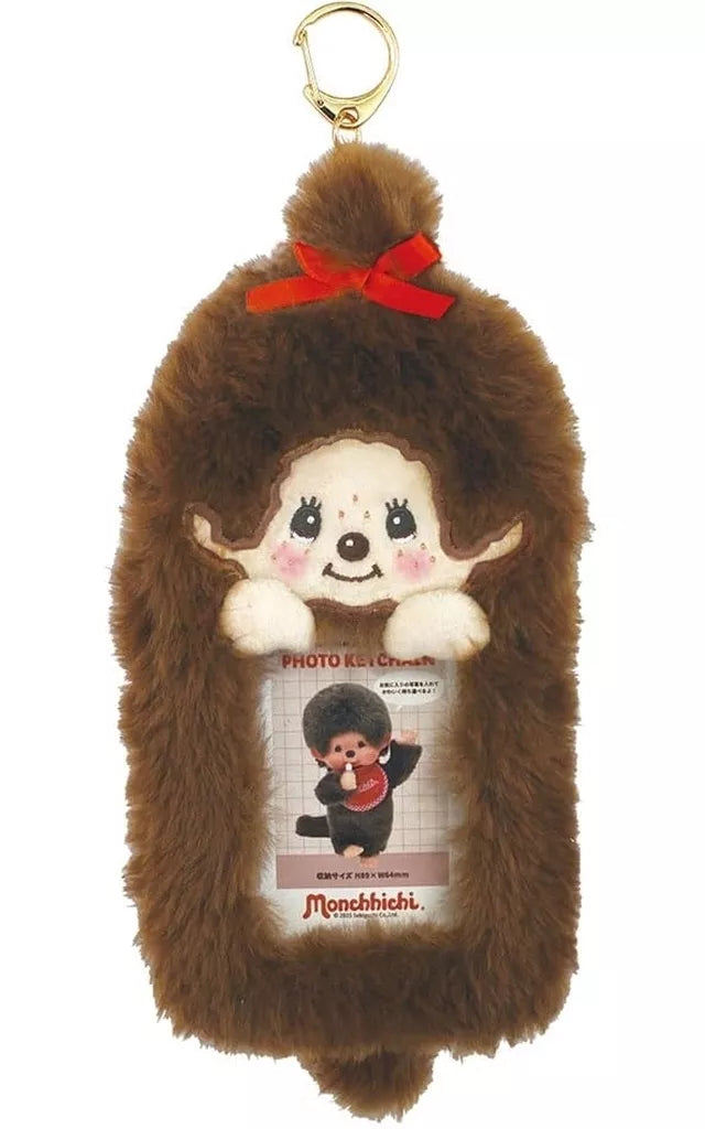 Monchhichi Plush Photo Keychain featuring a smiling face, red bow, and photo window, with a gold clip for easy attachment to keys or bags.