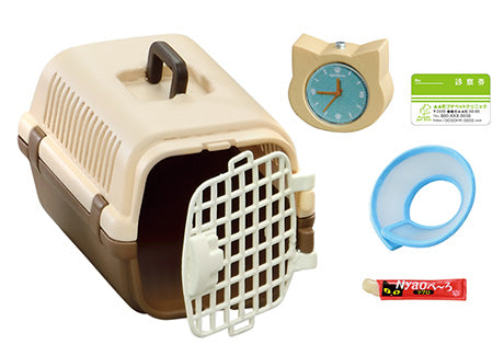 A small plastic pet carrier opens to reveal a clock shaped like a cat. Life With Cats Re-ment Blind Box Series offers 8 cat-themed designs.