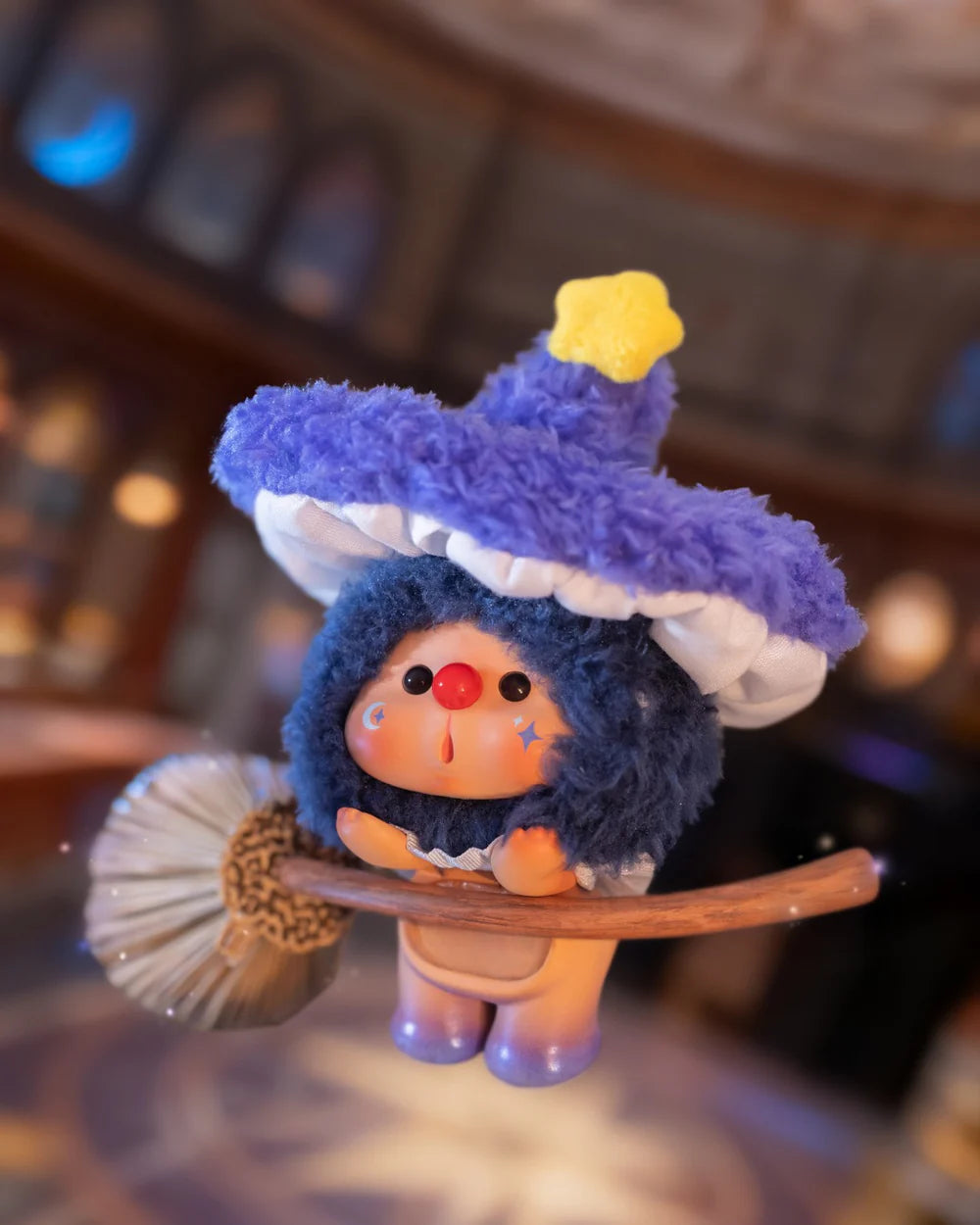 OYO Constellation Story Hipper Series Mini Blind Box figure, featuring a plush-vinyl hybrid with a ruffled hat, broom, and star decals on cheeks.