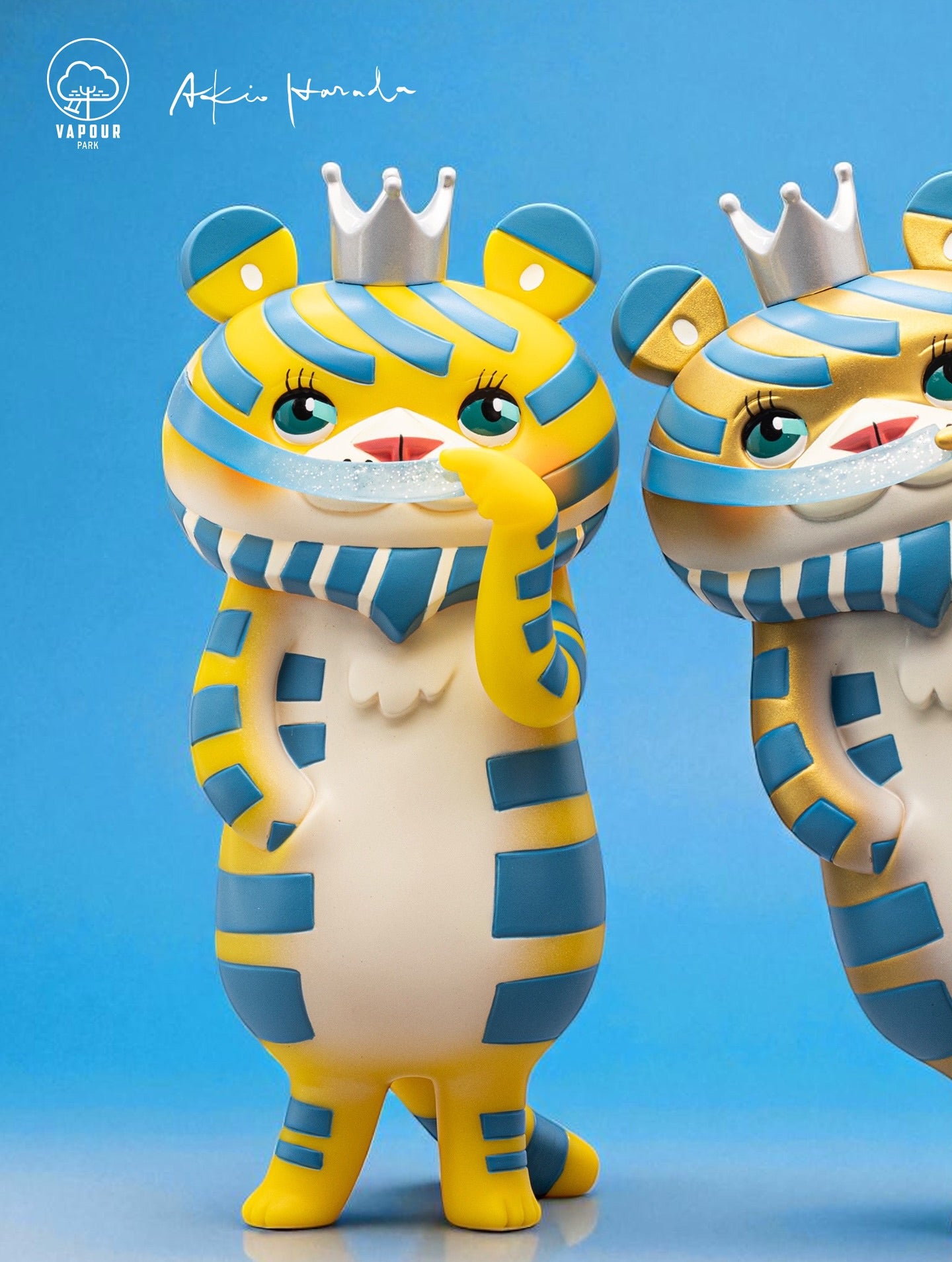 Bearded Tiger 6th Colorway by Akio Harada & Vapourpark, two yellow vinyl art toys with crowns and playful poses, available for preorder at Strangecat Toys.