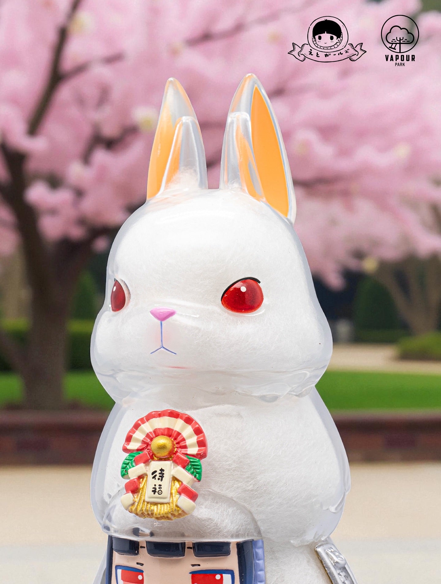 Kigurumi Bunny by Ebimomo & Vapourpark: A 15cm vinyl art toy with red eyes, pink-orange ears, and a Japanese charm, available for preorder.