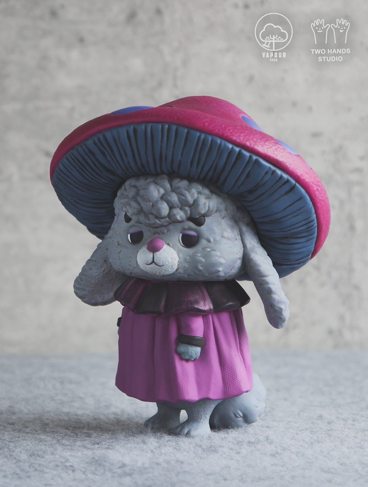 Mushroom Chipmunk Violet Edition figurine by Vapour Park X Two Hands Studio; features a woolly rabbit-like creature with mushroom cap, fuchsia outfit. Preorder now.