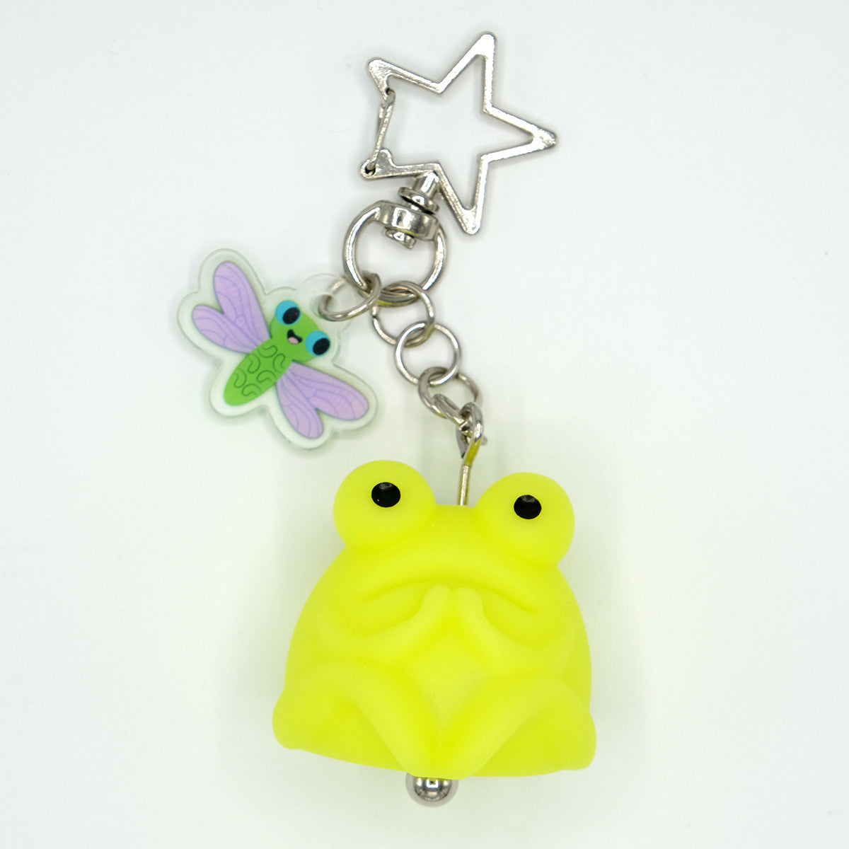 Fruggie the Toad Bag & Key Charms by Horrible Adorables: A glowing vinyl toad with a smiling dragonfly charm, perfect for adding quirky flair to bags or keys.