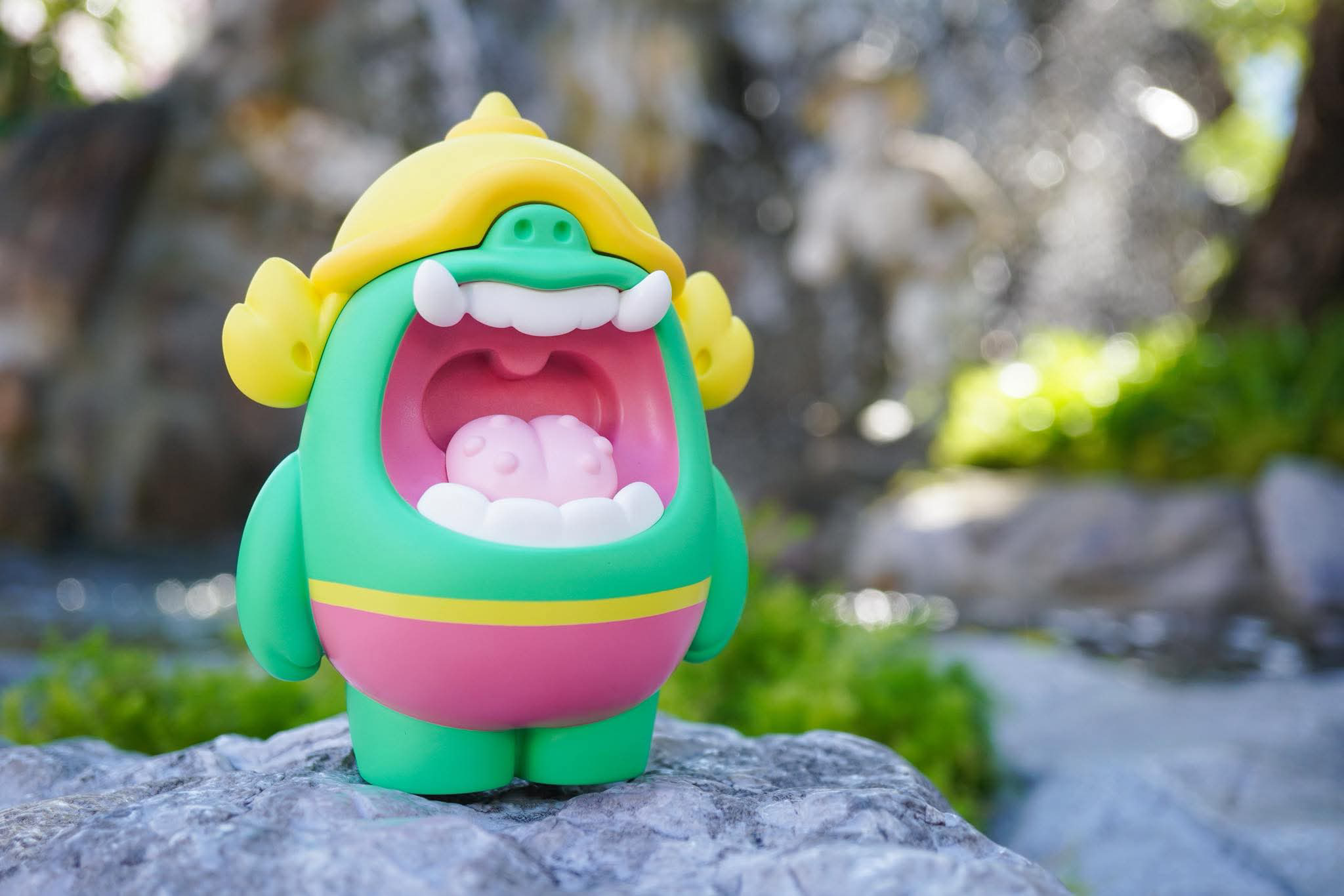 Mallow Yak by MUPA vinyl toy featuring a cartoon-monster with green body, yellow helmet, and pink band, available for preorder at Strangecat Toys.