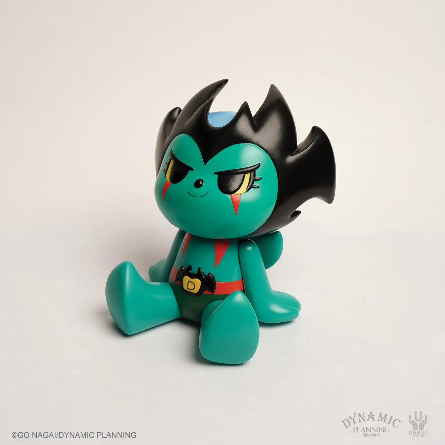 Go Nagai Devilman by Too Natthapong: Emerald stylized devil figure with bat belt buckle and cape, collectible art toy from Strangecat Toys.